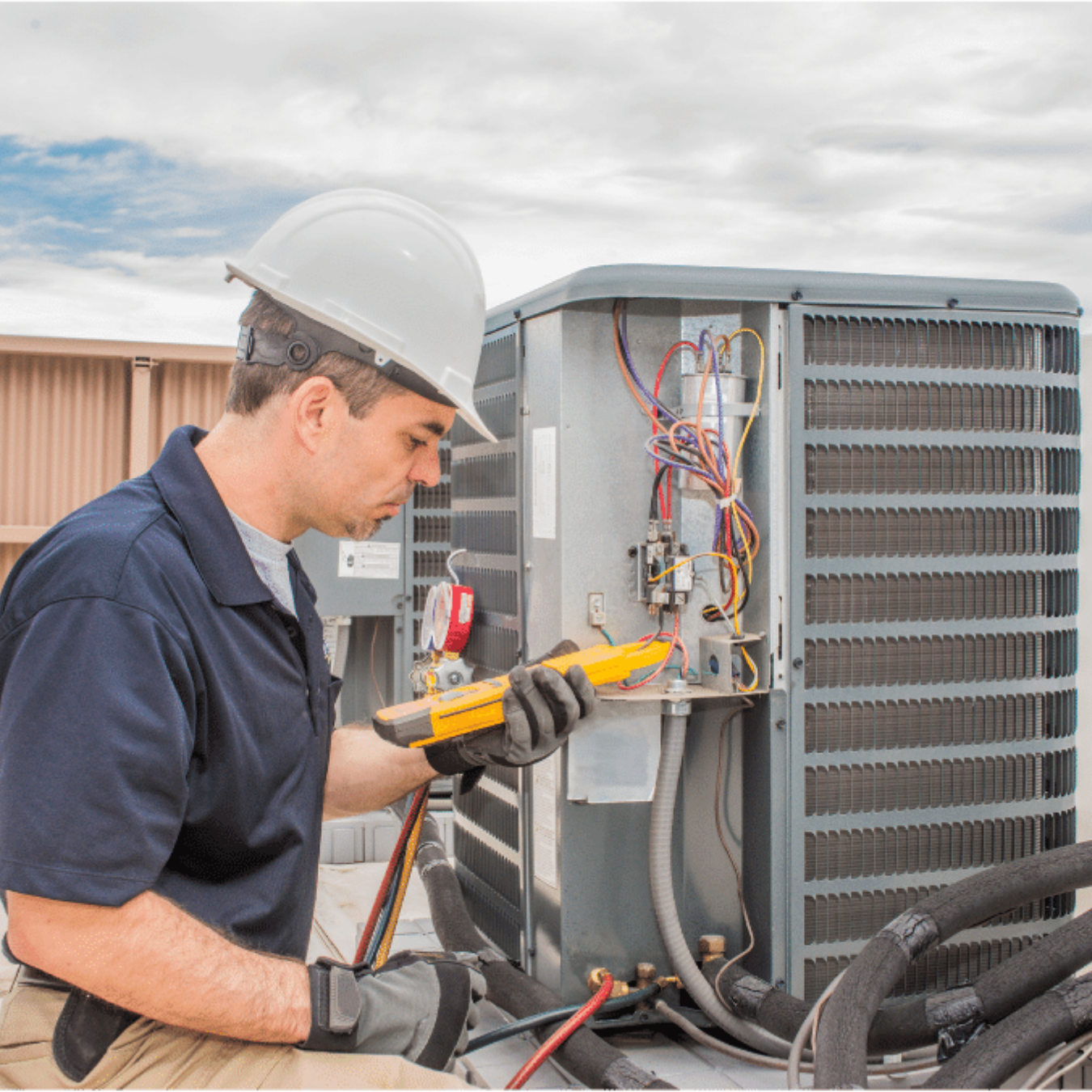 LaSalle Heating & Cooling HVAC technician servicing a system