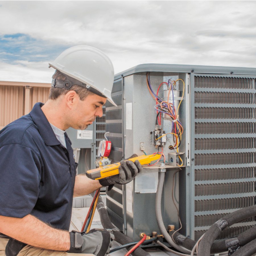 LaSalle Heating & Cooling HVAC technician servicing a system