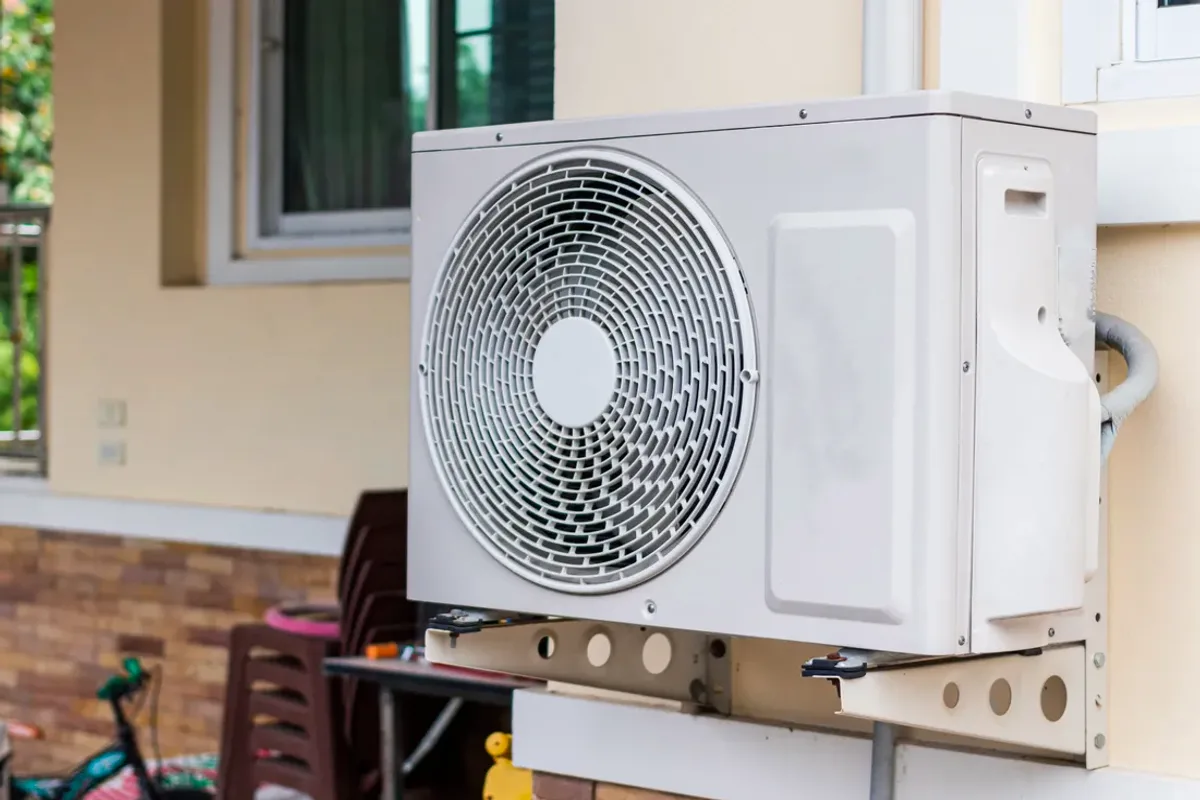 Outdoor heat pump unit on a wall bracket